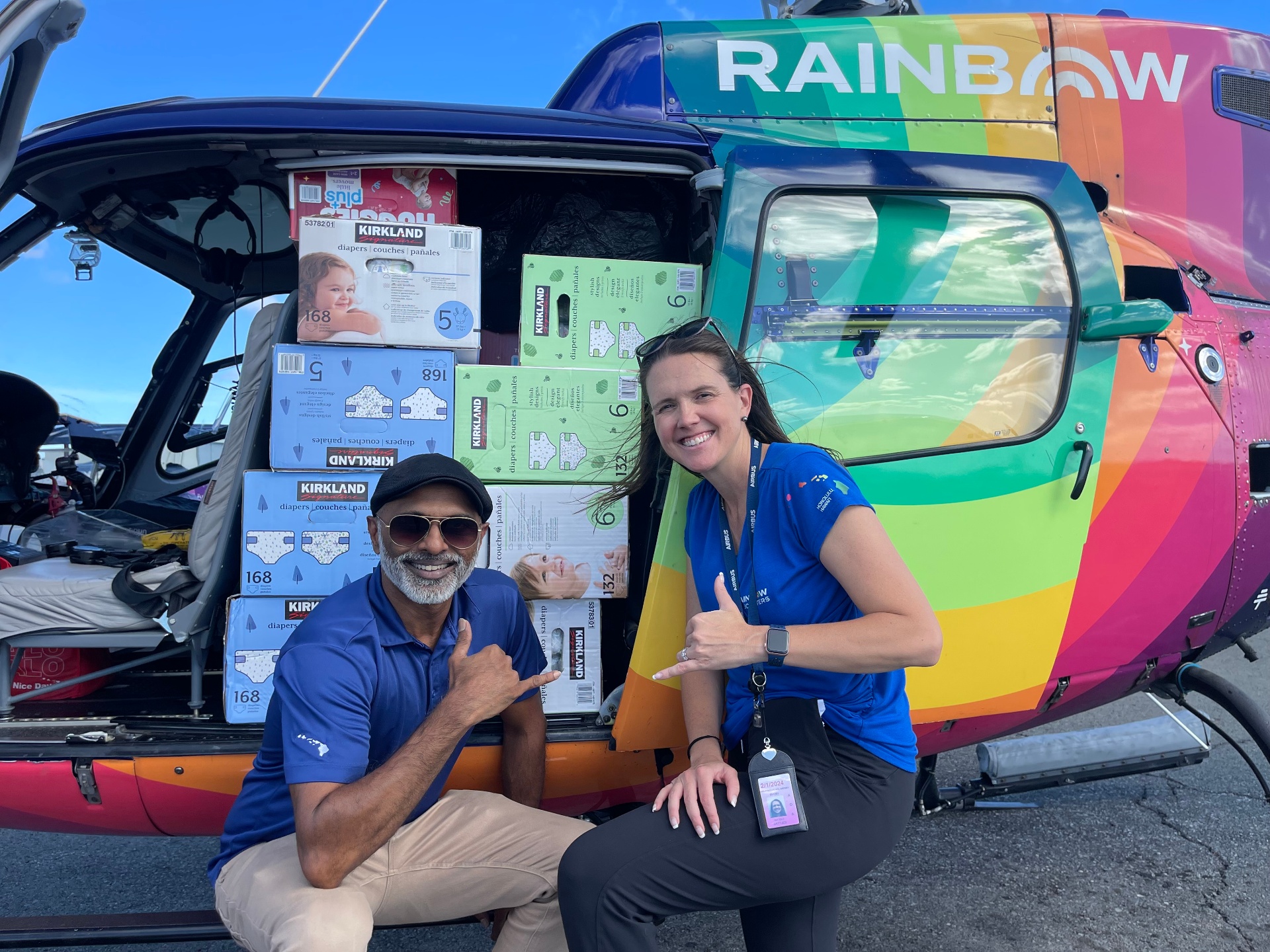 Shree Sadagopan with Nicole of Rainbow Helicopters loading Maui fire relief supplies